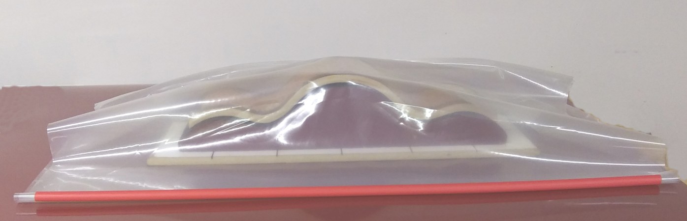 applying c channel closure to three sided bag