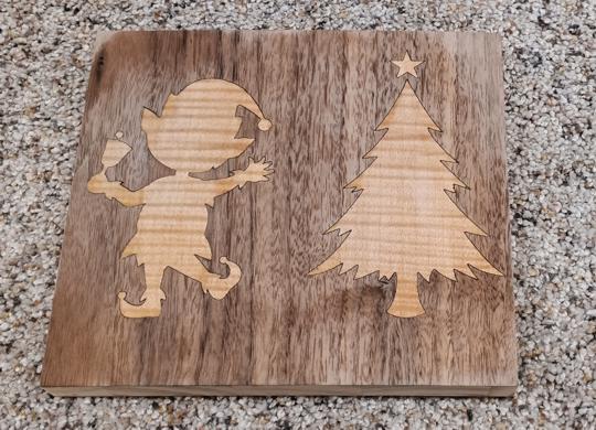 Picture of finsihed veneered holiday silhouette of santa eleves