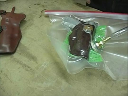 Leather holster in vacuum bag under vacuum