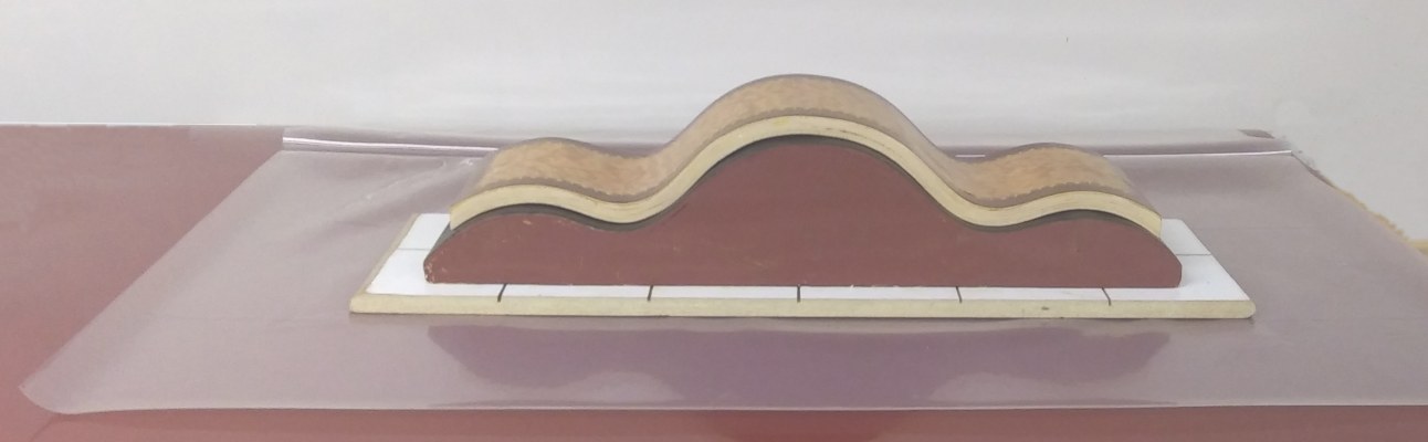 three sided bag folded open with curved form